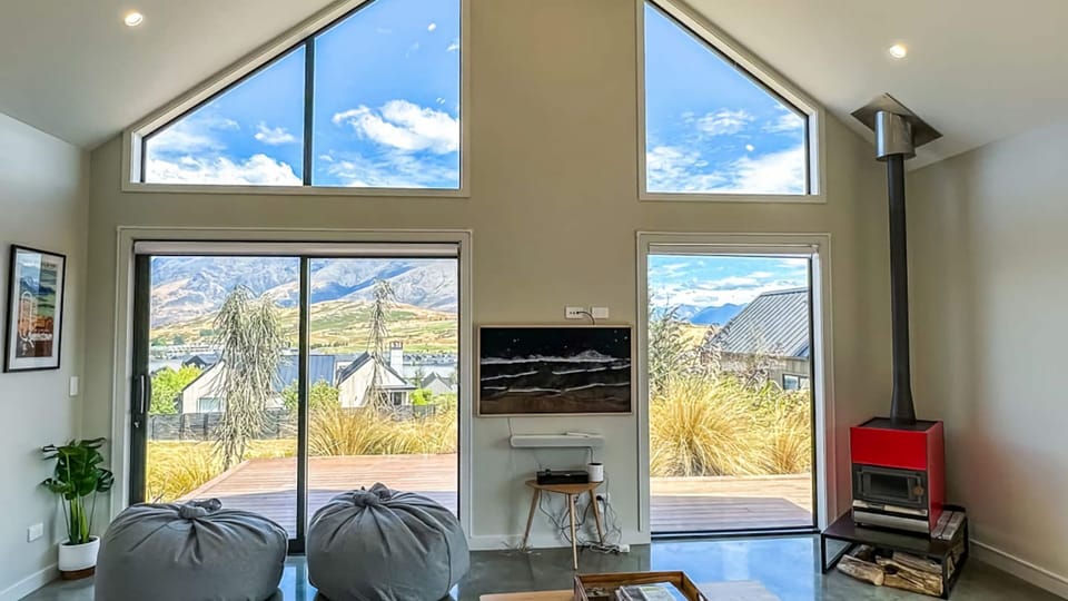 Lounge with feature window and wood fire