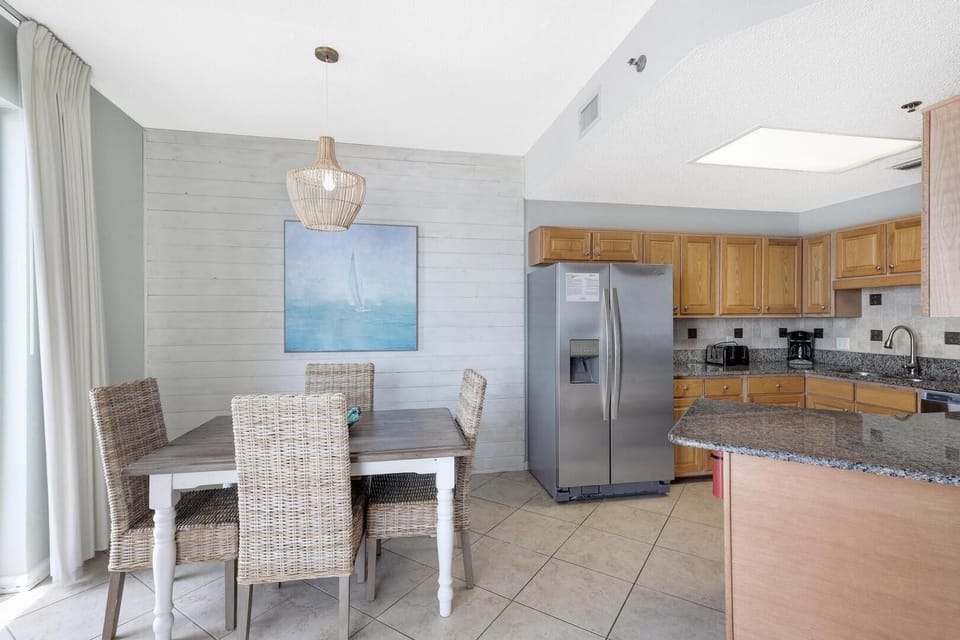 The dining and kitchen area is the heart of the home, where delicious meals and cherished memories are made. With a well-equipped kitchen and ample dining space, it's the perfect place to gather, cook, and enjoy wonderful moments together.