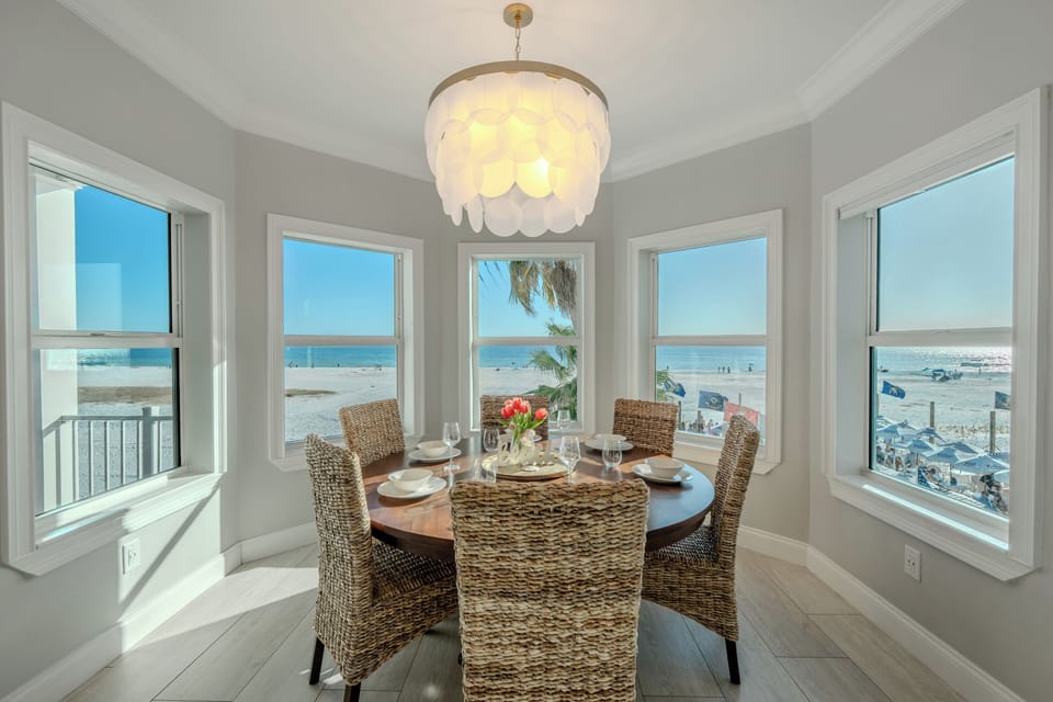 Naturally lit dining space with beachy, modern décor.