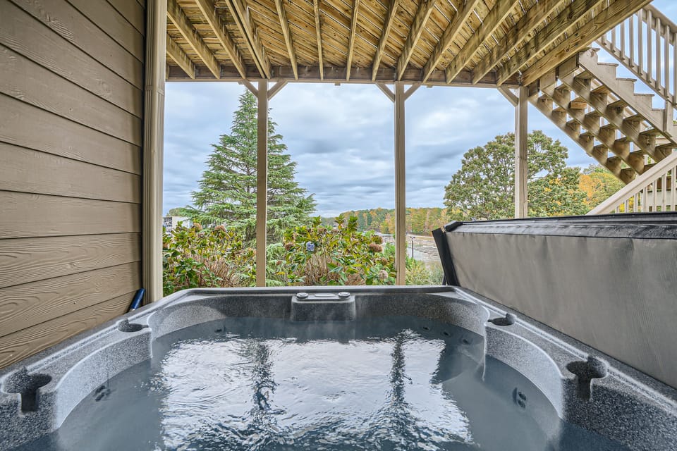 Hot tub on lower level with nice view of Lake Lanier and the marina. 