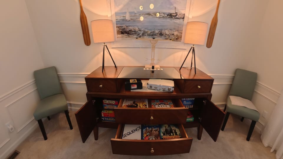 Board games stored in dining room hutch. Poker overlay is stored under hutch. 