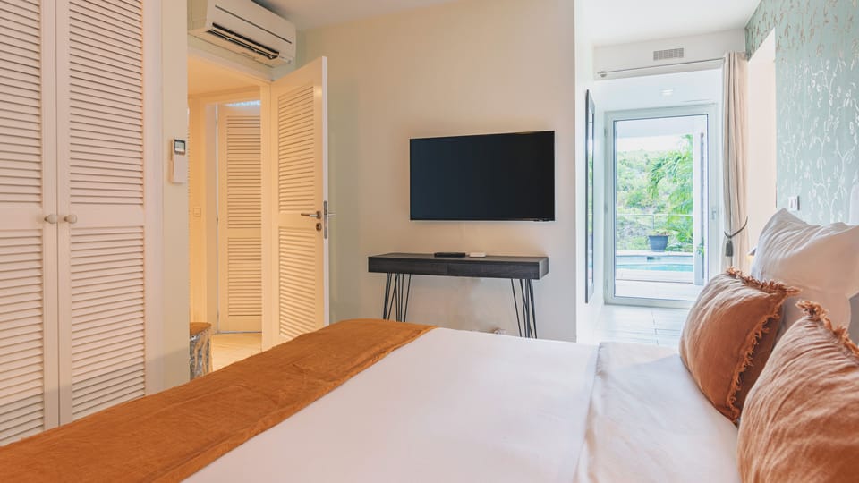 The Jardin Room has a Smart TV with cable and direct access to the Pool Deck.