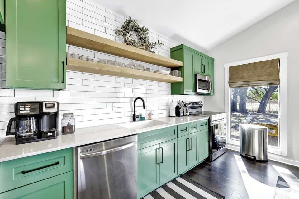 Cook in style with a full kitchen featuring sleek stainless steel appliances.