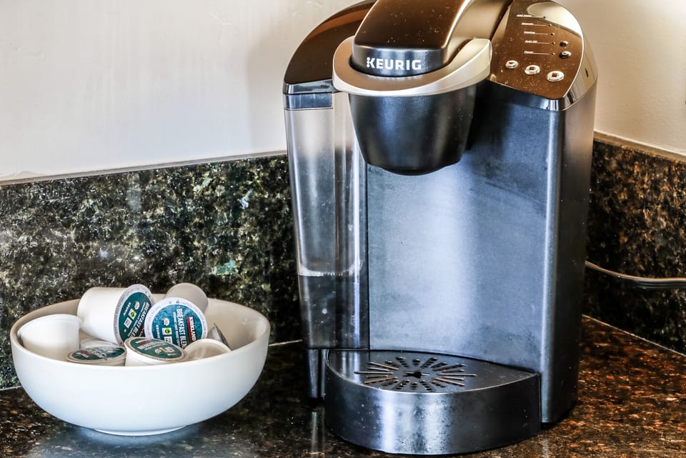 Keurig coffee maker with coffee pods provided for your convenience. 