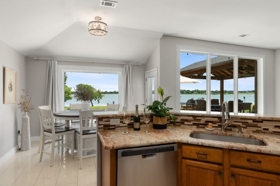 This mesmerizing lake view from the kitchen sink can make washing dishes a easy!