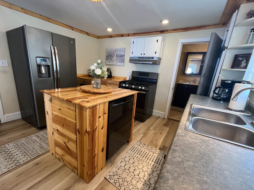 Kitchen, complete with fridge, oven/stove and dishwasher.