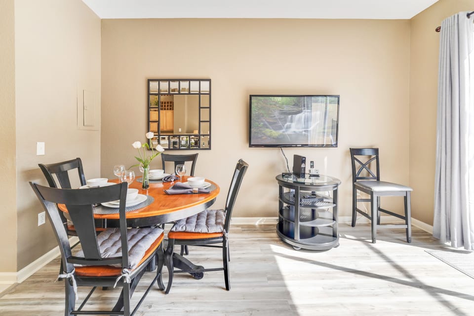 Open concept dining room exiting into the private pool area