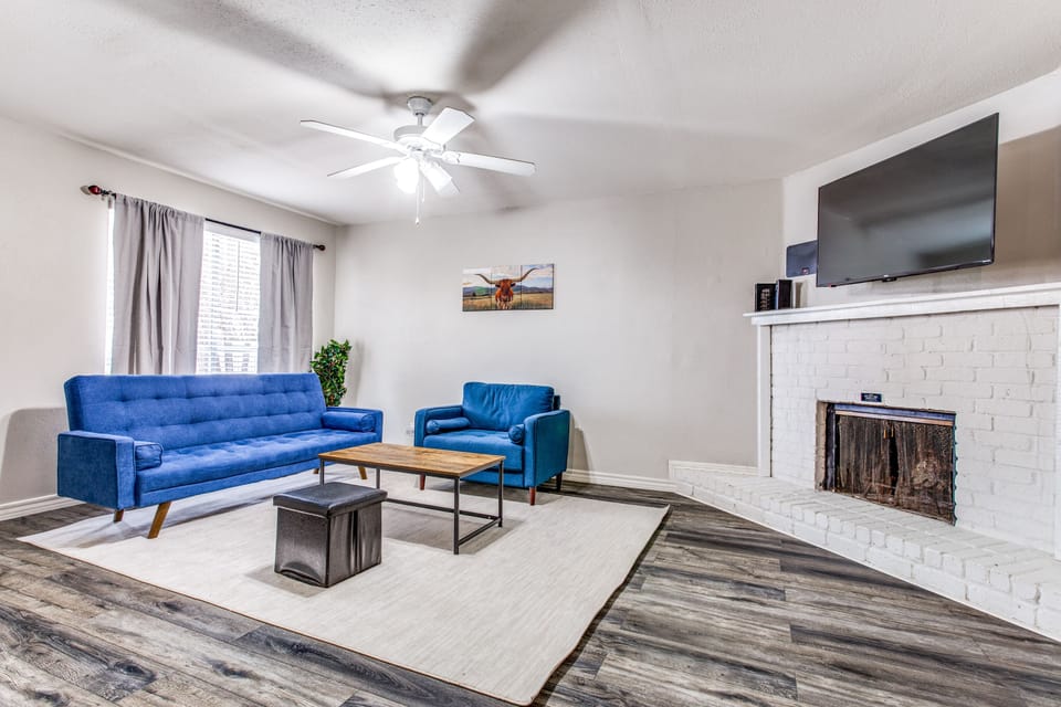 Unwind on the Cozy Blue Sofa & Armchair, While Watching Your Favorite Movie