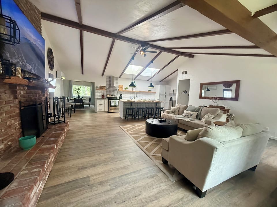 Open Living room that leads to dining and game room