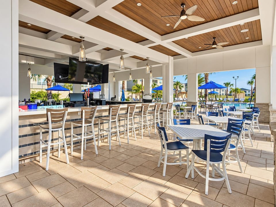 Covered poolside bar and outdoor dining patio