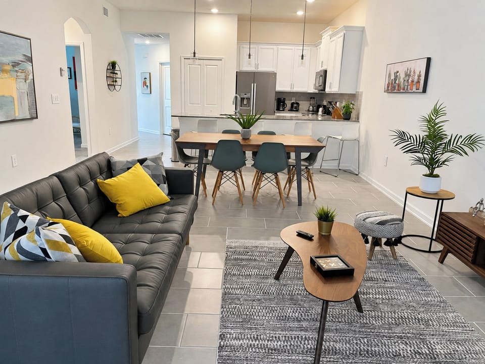 Open-Concept Living Area with Dining Table and Modern Kitchen