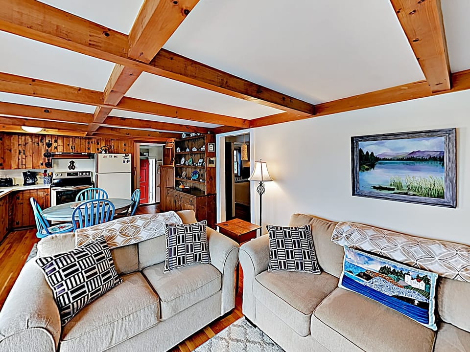 The living room, dining room and kitchen are open concept with a great view of the ocean.