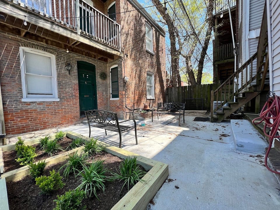 Shared courtyard. Front entrance is on the right and up the stairs.