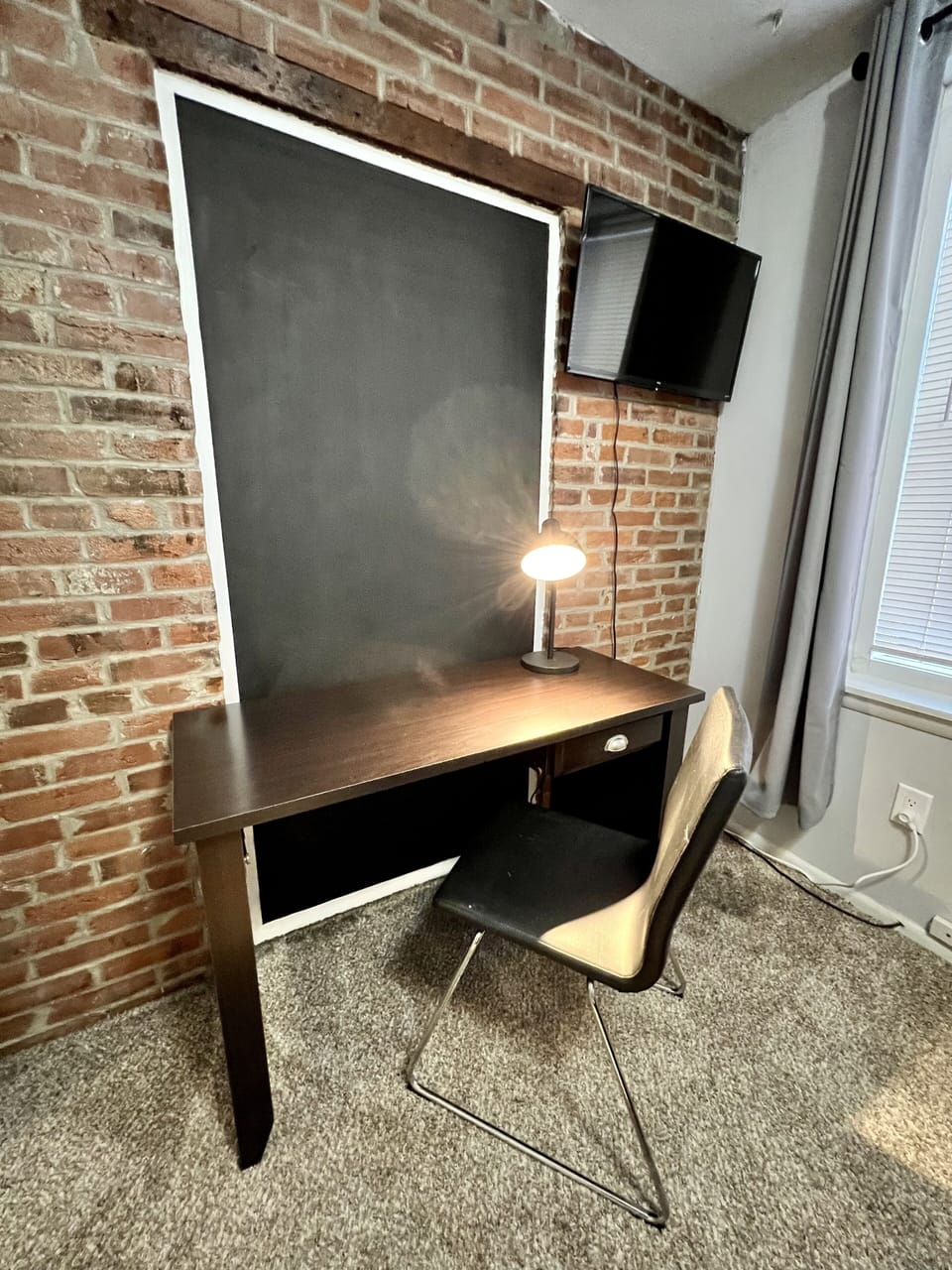 Bedroom 1 -Dedicated workspace with desk, lamp, chair, and TV with hulu/netflix.