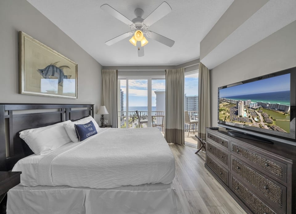 Suggestion 2: Relaxing primary suite featuring a king bed, 53" TV, and Gulf-view balcony.
