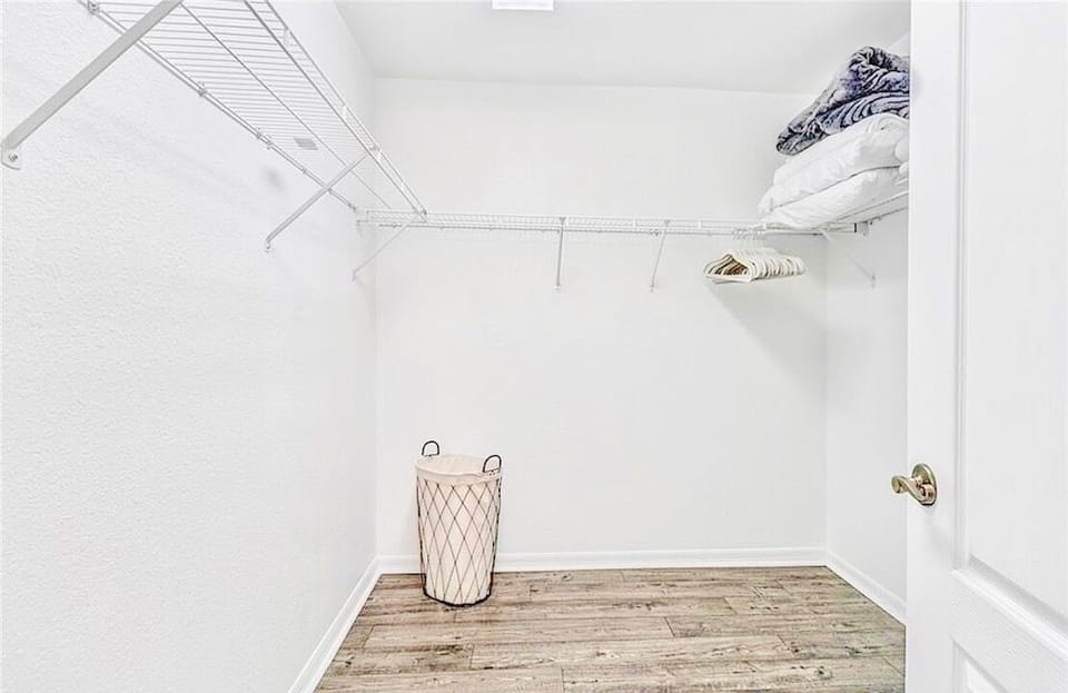 Primary bedroom features a huge walk-in closet 