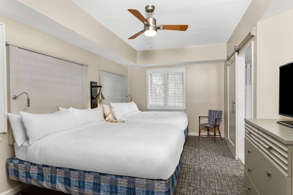 Guest bedroom features 2 queen beds and an ensuite bathroom..