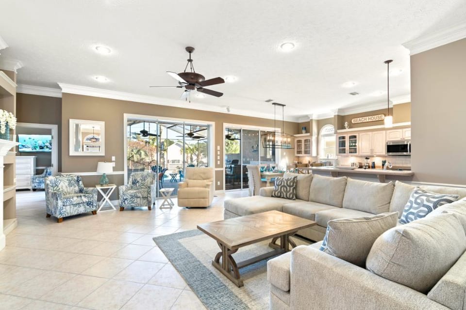 Spacious living area opens directly to the lanai — perfect for families or 2–3 couples traveling together.