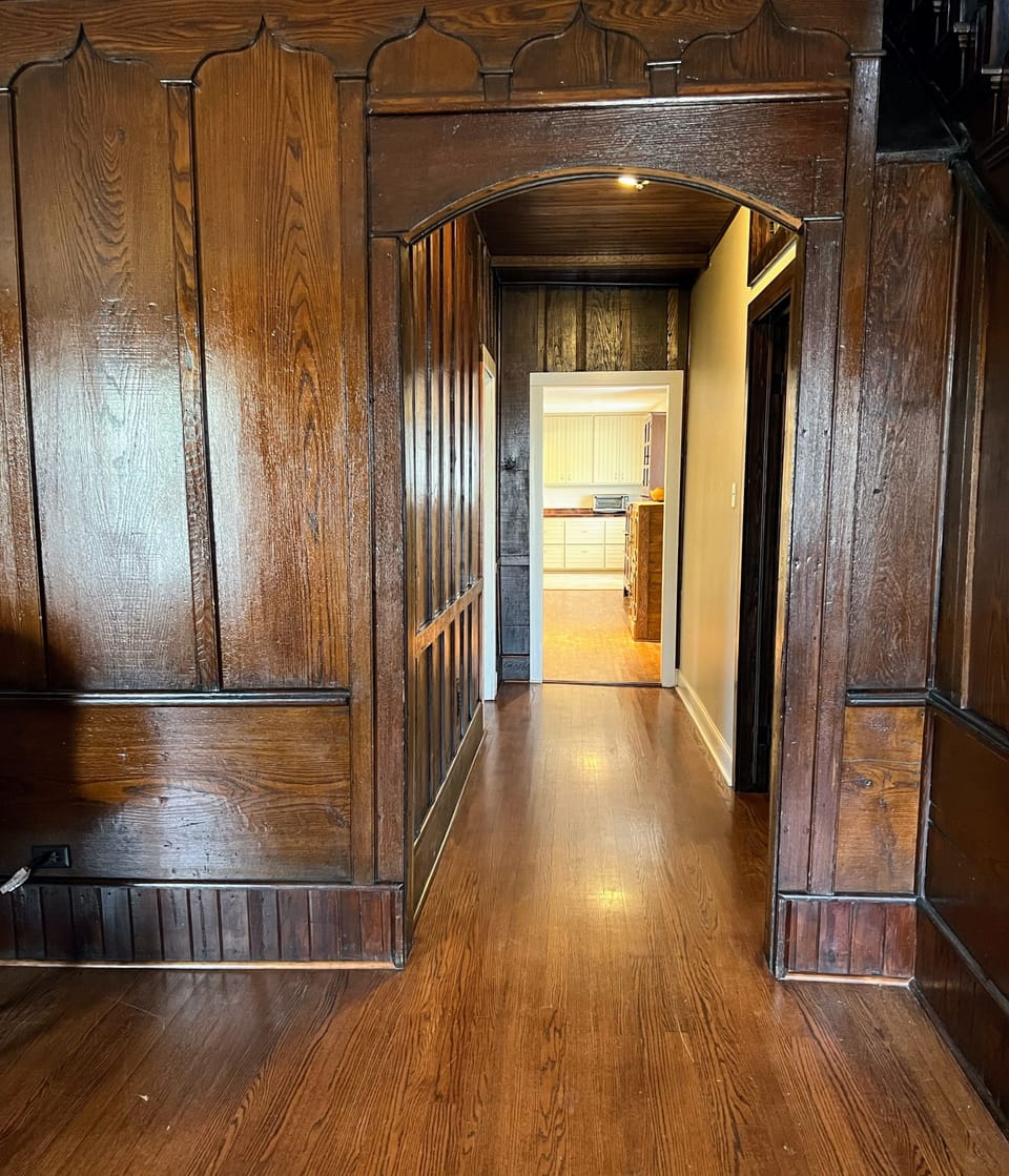 Enjoy the warm antique wood paneling in living room