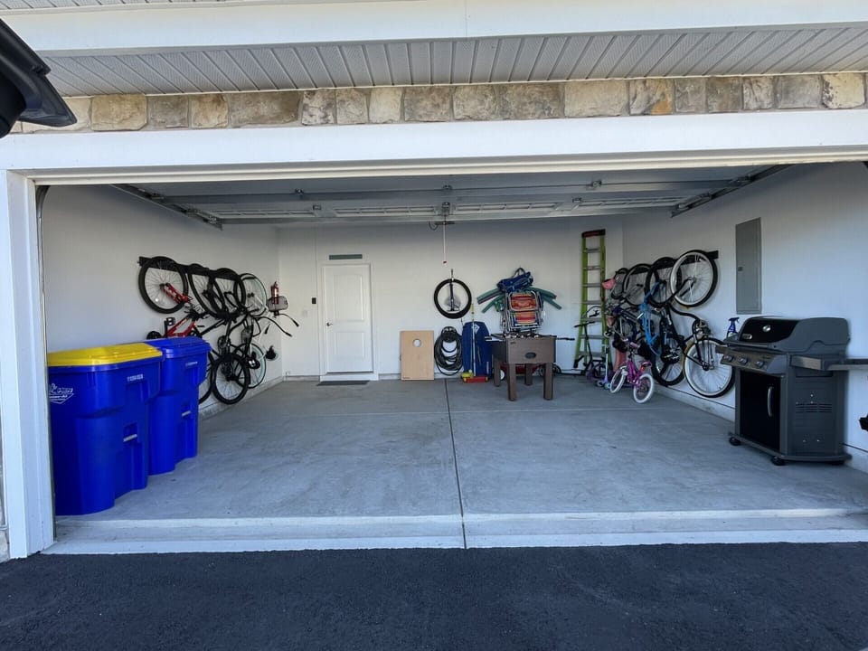  9 bikes for all ages, beach chairs,BBQ grill, foosball table, cornhole 
