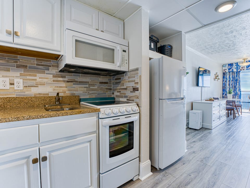 Kitchenette includes toaster, blender, coffee maker, dishes, and basic cookware.