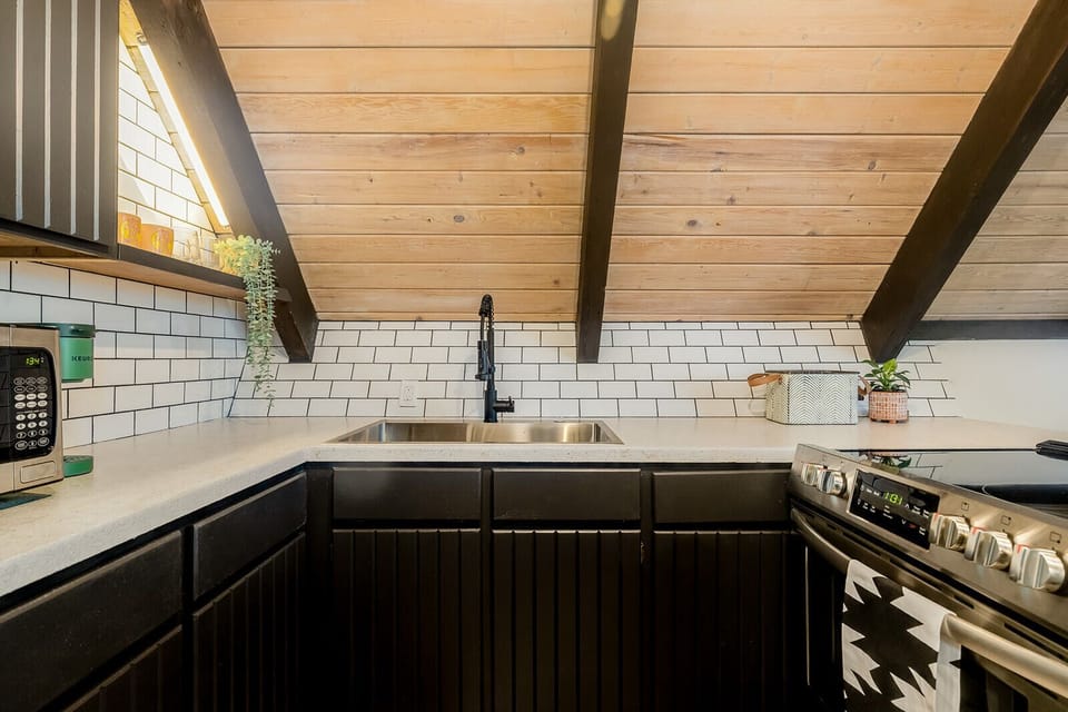 Full kitchen w/ new stove, full fridge, and all the cooking utensils you need