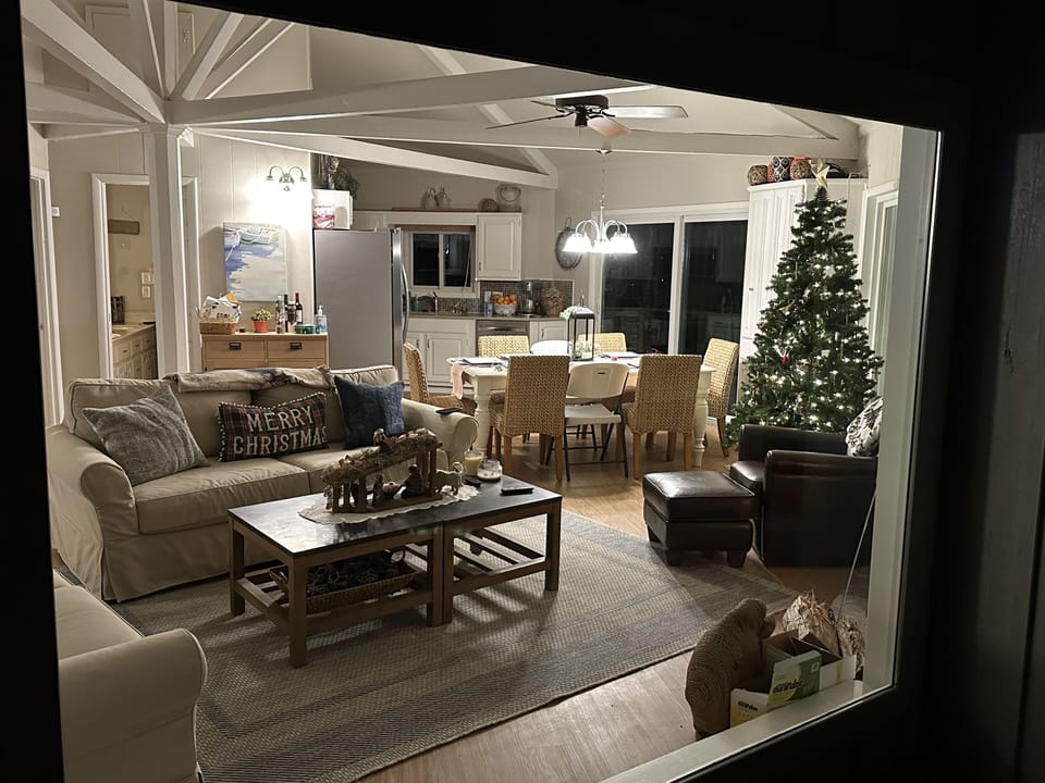 Christmas from deck looking in - unique Octagon home construction