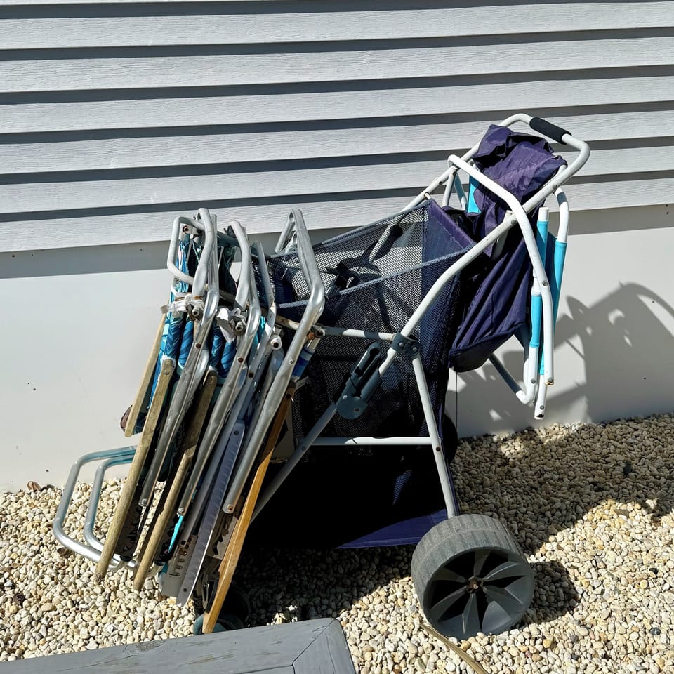 Beach chairs, and an outdoor cornhole game