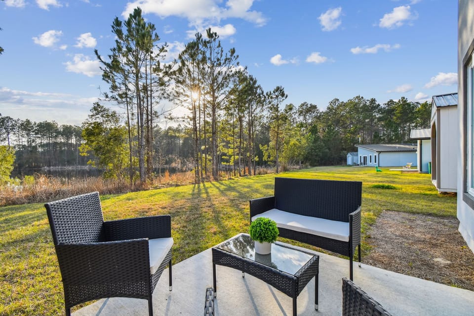 Seating and view from the back yard! Stunning. Watch the sun set on the lake.