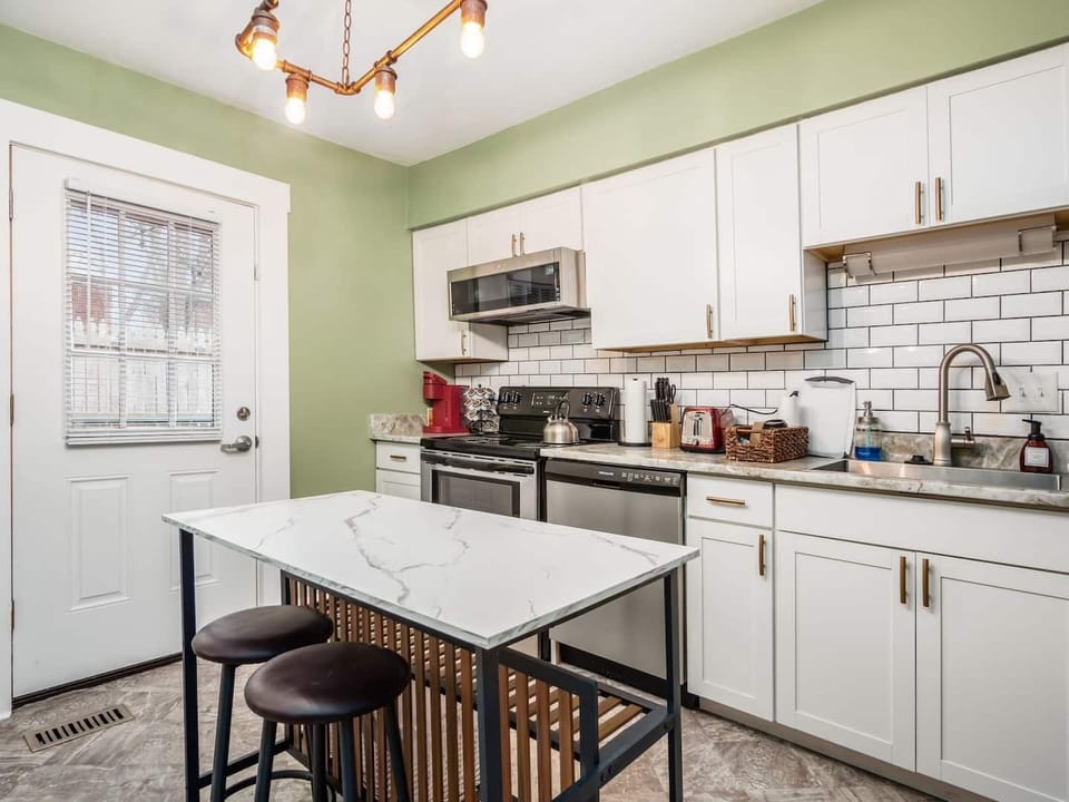 Fully-stocked kitchen with island and dishwasher