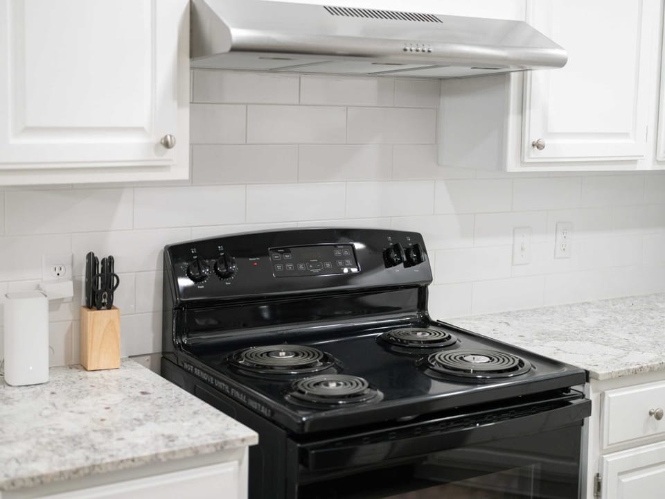 Kitchen offers modern appliances and all the cookware you need