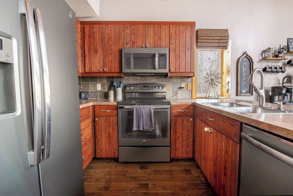 Kitchen is fully stocked and includes blender, crock pot, all dishes, glasses, silverware, cooking trays/ baking sheets, pots and pans, toaster, waffle-maker, knife set