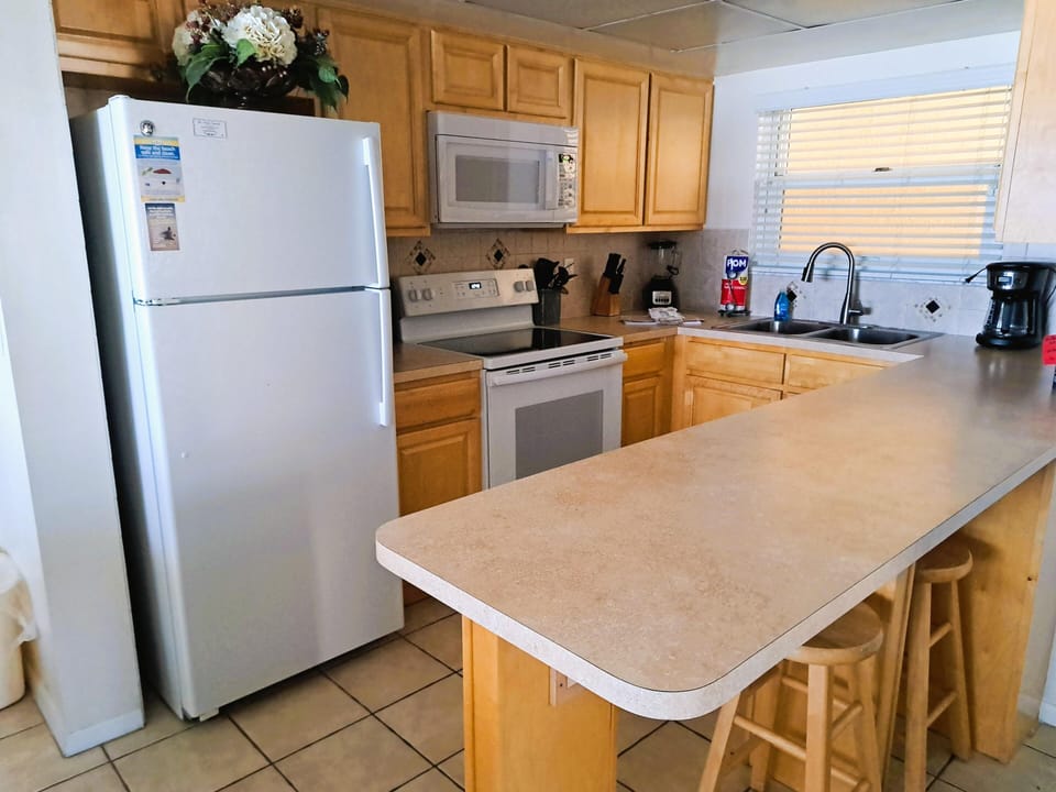 Bright kitchen with spacious counter and modern appliances