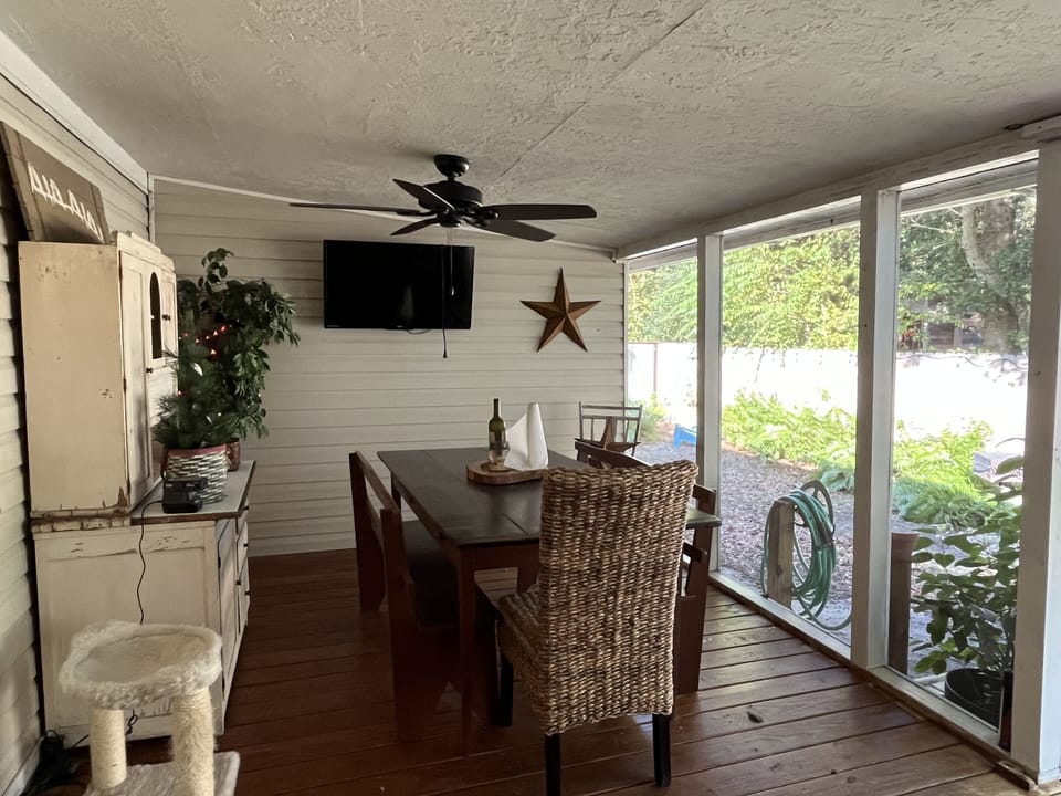 Amazing screened-in back porch that leads out to the relaxing private courtyard.