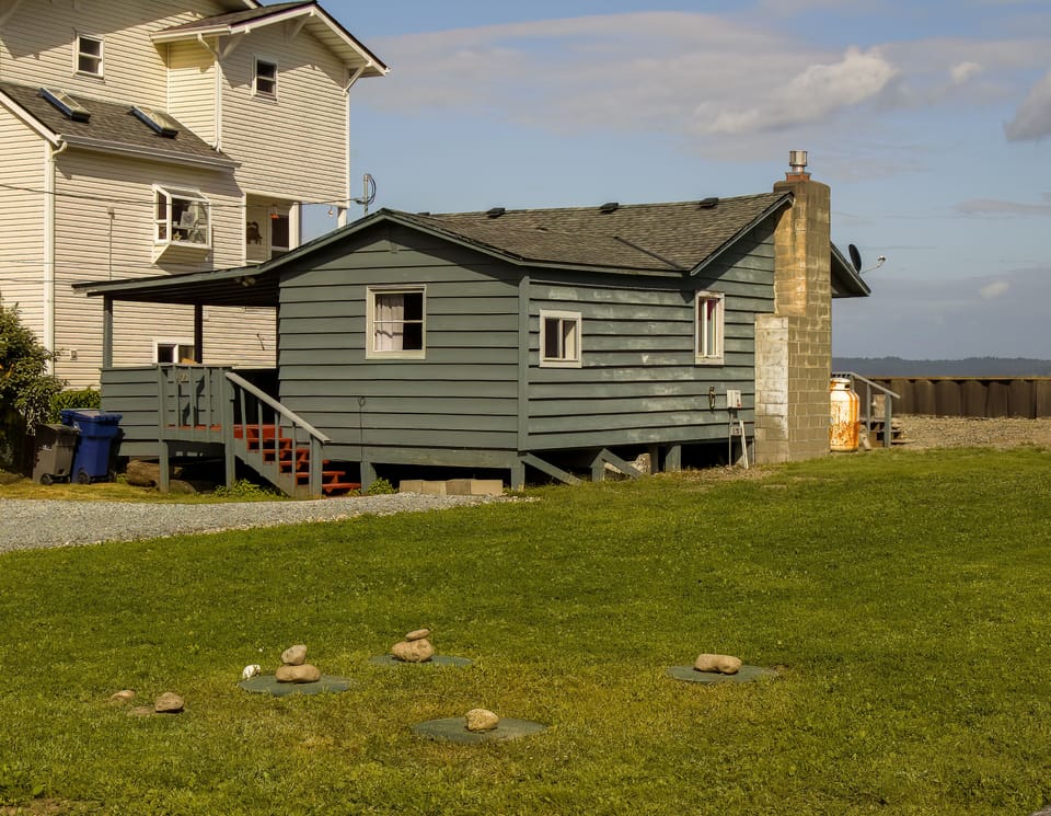 Driveway and side yard of Cabin on .32 acres of land
