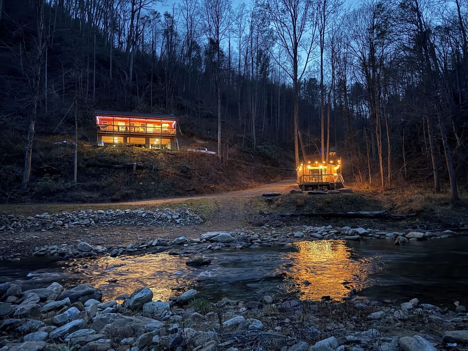 View of the cabin and the river deck pavilion from across the Elk River.