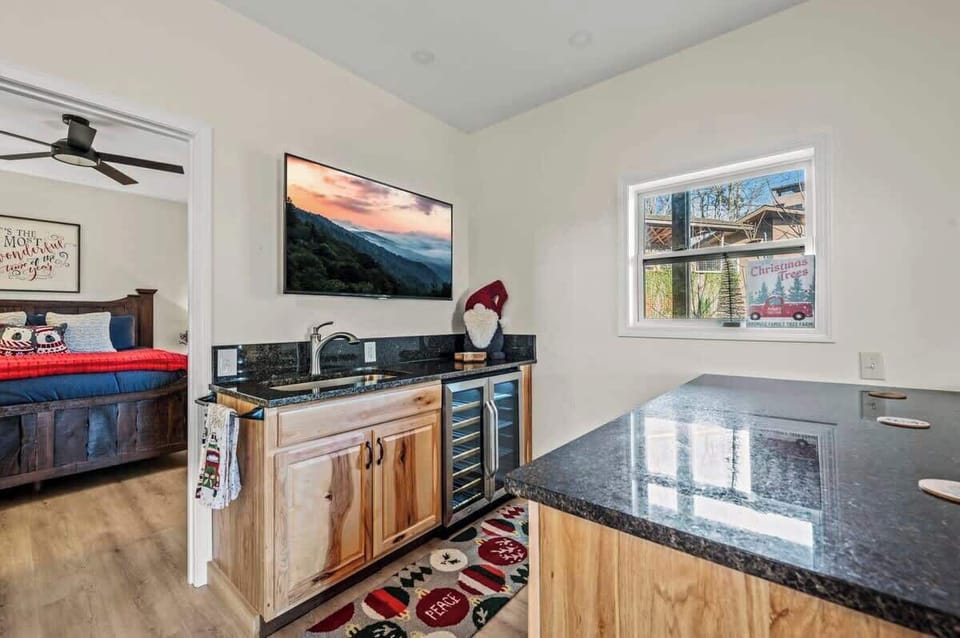 This cozy bar area is perfect for mixing up your favorite drinks or enjoying snacks. Convenient and stylish, it adds a fun touch to your stay, making every gathering special.