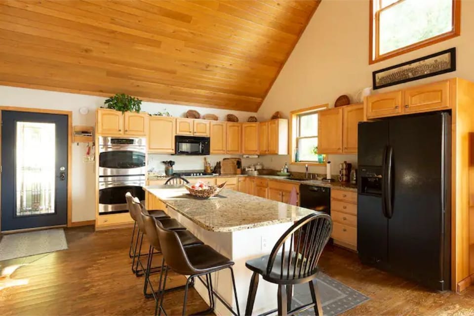 Double oven in Cooks kitchen. All pots, pans, and appliances.