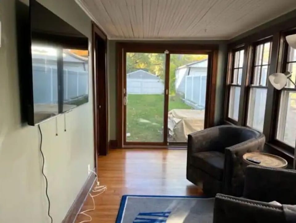 Side porch with large screen and bar.