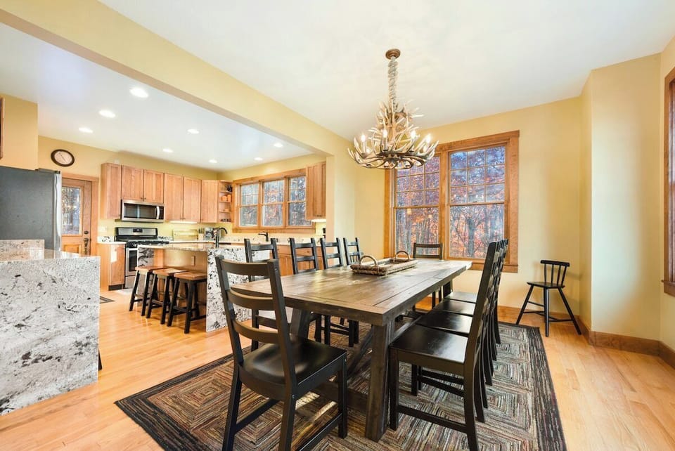 Open floor plan of Dinning/Kitchen area allows for togetherness will cooking and dinning. 
Table seats 10 comfortable, plus 2 toddler highchairs in corners and 1 infant highchair not pictured.