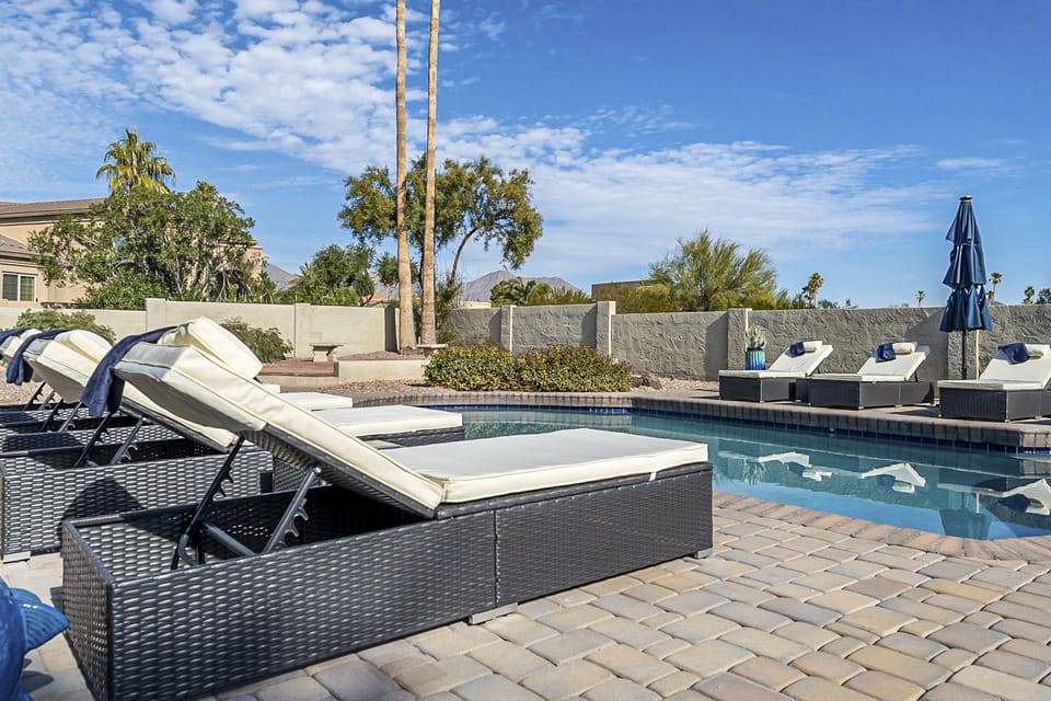 Heated pool with 10 lounge chairs to lay out, relax, and enjoy the AZ sun!
