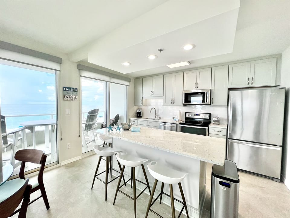 Stainless and White Granite Kitchen with Island Breakfast bar.