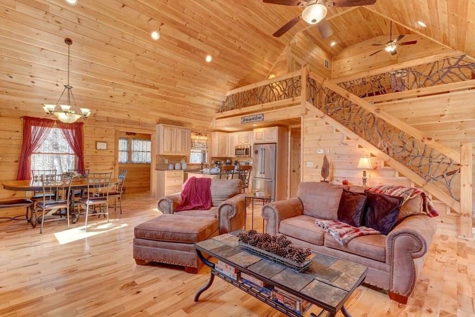 View of Living Room Dining Room Kitchen and Stair up to the Loft