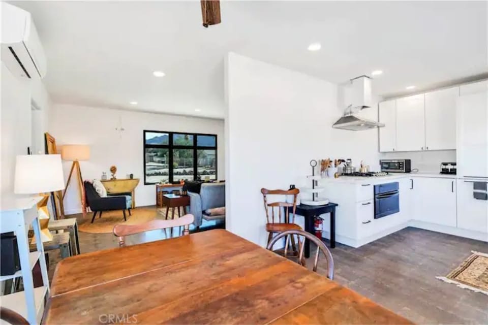 Living room and kitchen from the dining area. Table seats 4 - 8. 