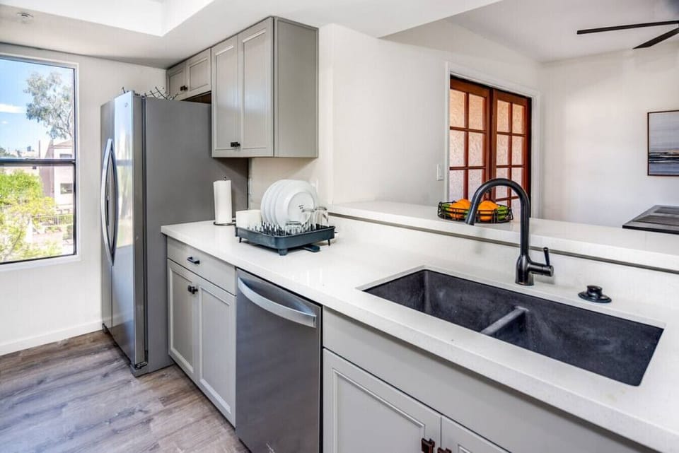 Dishwasher, modern sink, frig, stainless steel appliances