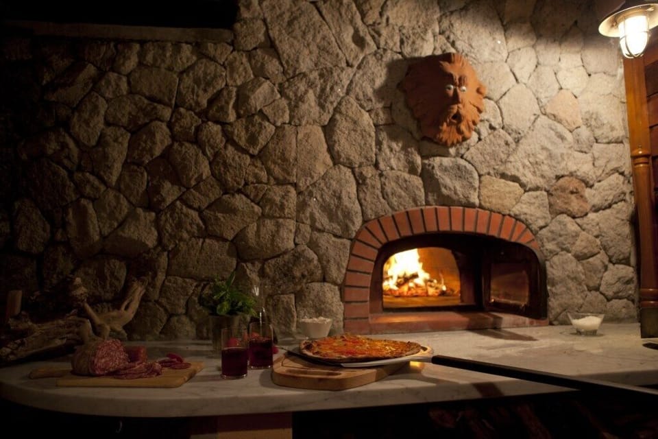 Pizza oven located near the kitchen.