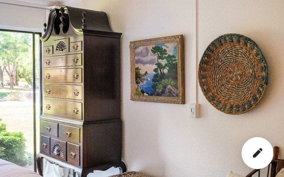 Master Bedroom with Antique furniture mixed with high end contemporary finishes.