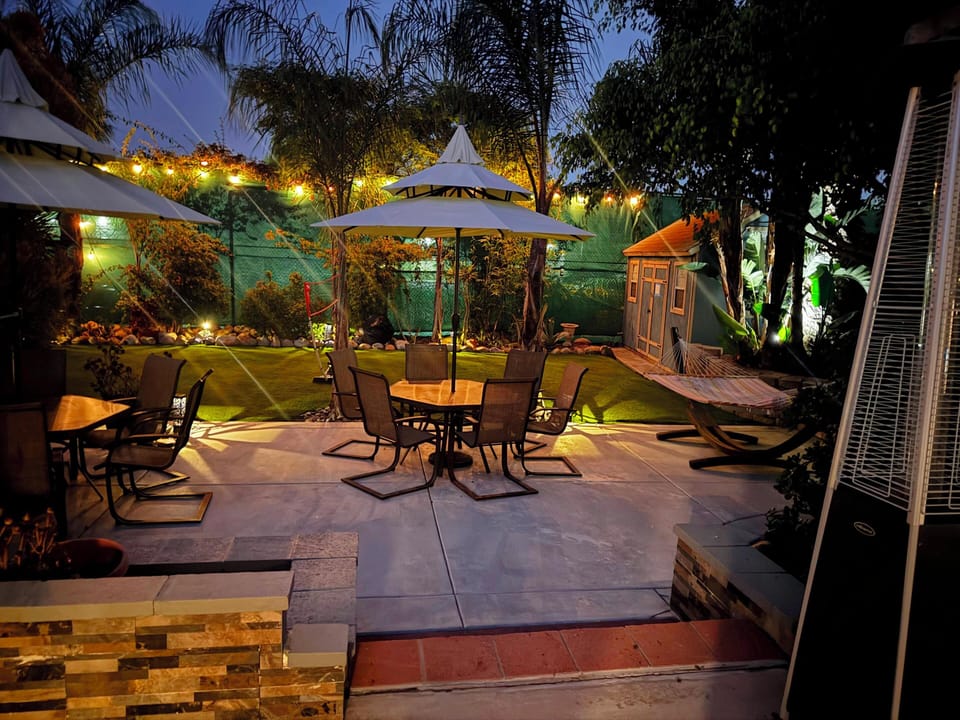 Entertainer's dream: Bright patio, hammock, and yard for games.