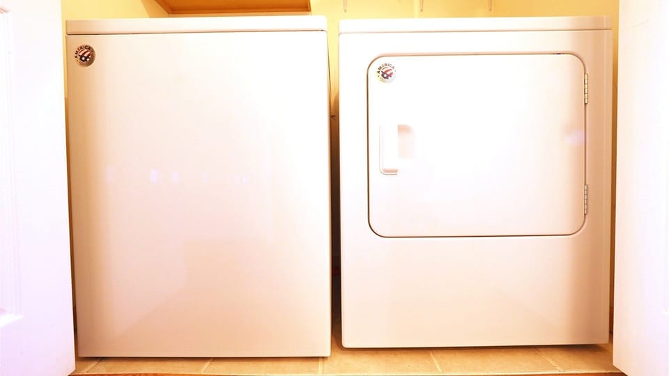 Washer and dryer in closet in hallway