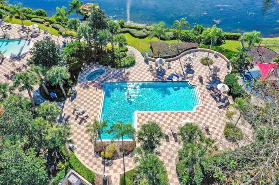 Poolside Paradise: Dive into relaxation at our beautiful community pool surrounded by lush greenery!